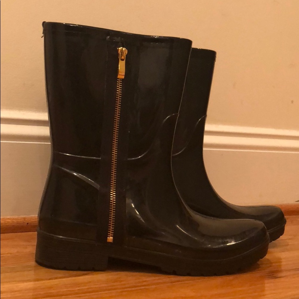 Black rain boots with gold zippers